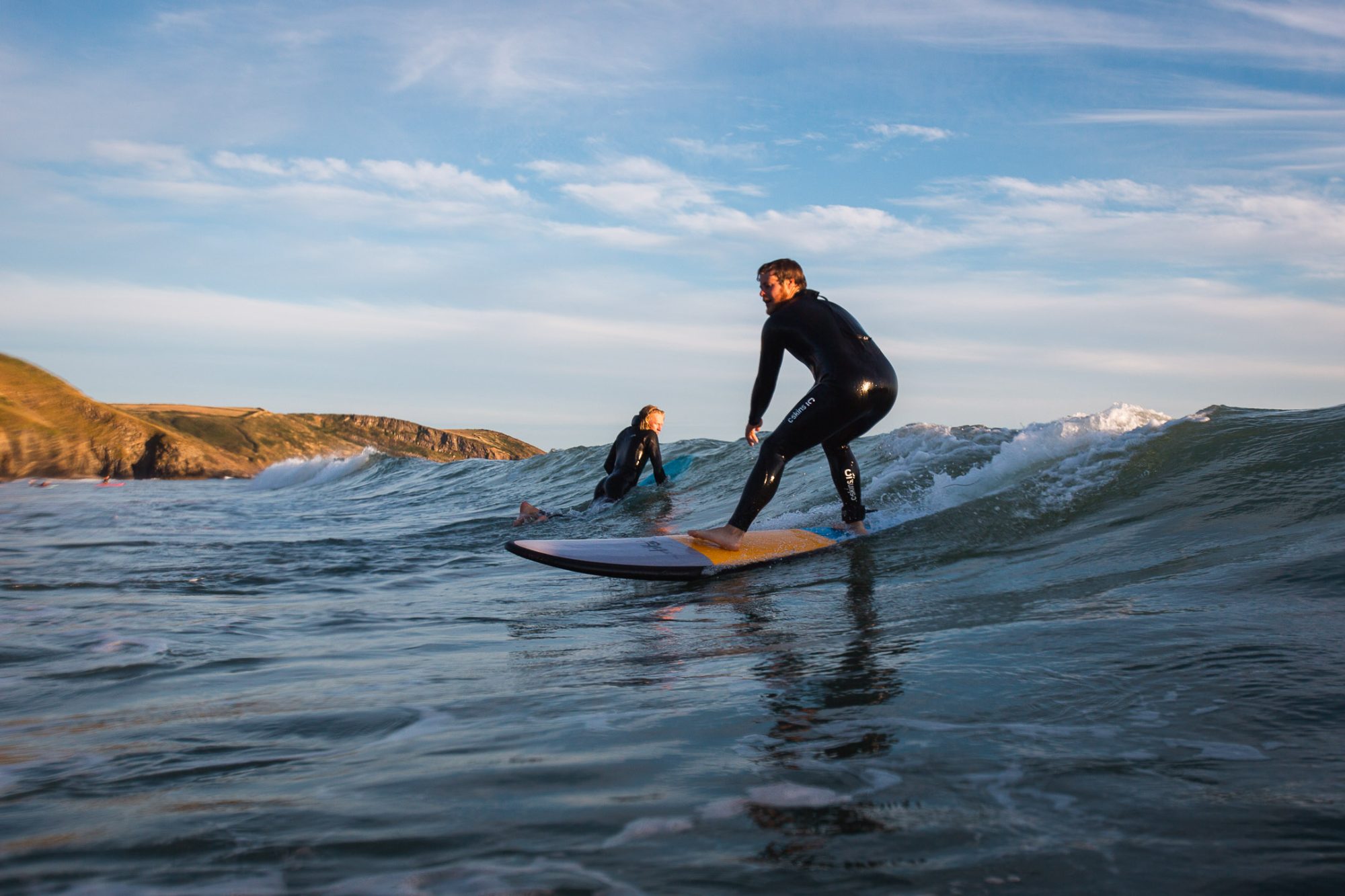 Particapant surfing a green wave in Pembrokeshire with TYF
