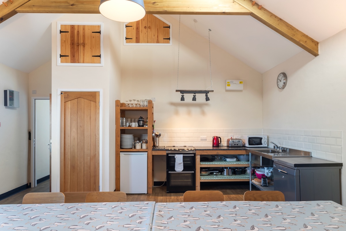 Shared self-catering kitchen and dining area at the outdoor training centre